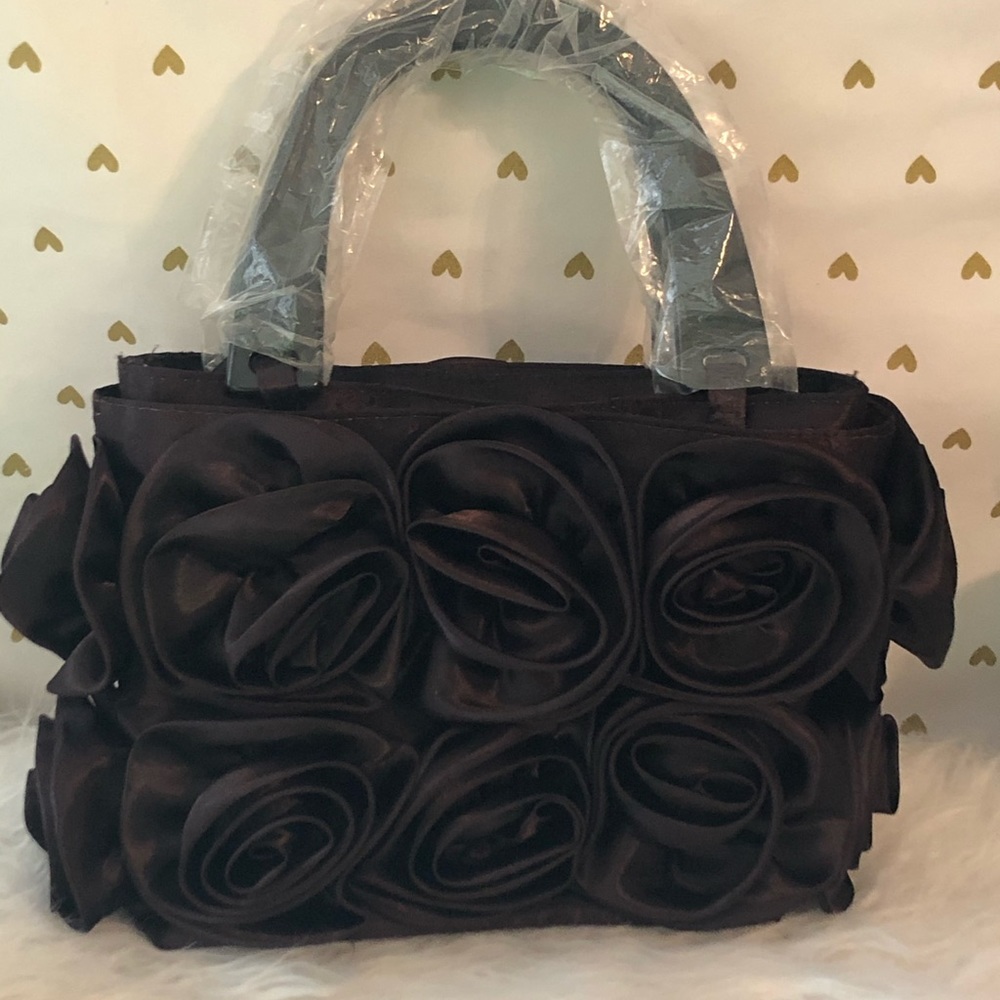 Small rose covered purple hand bag.